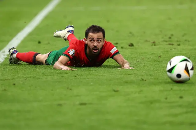 Bernardo Silva reacts on the ground