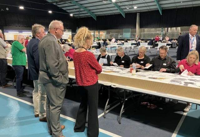 People at an election count in Devon