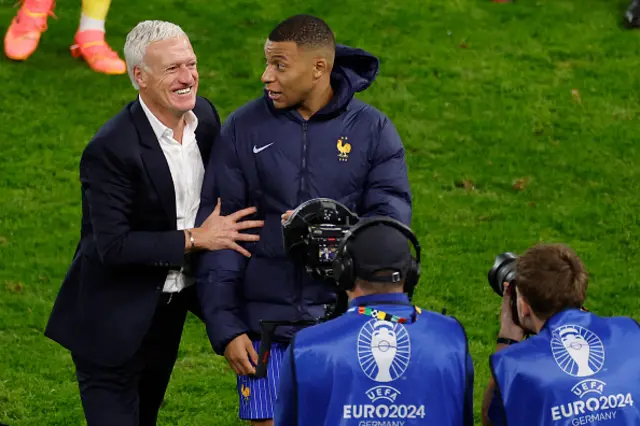 France's head coach Didier Deschamps and France's forward #10 Kylian Mbappe celebrate