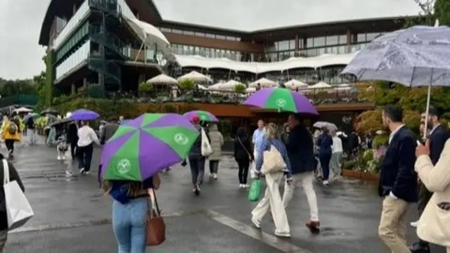 People walking with umbrellas