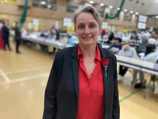 Labour's Kate Osborne smiling at the camera at the count