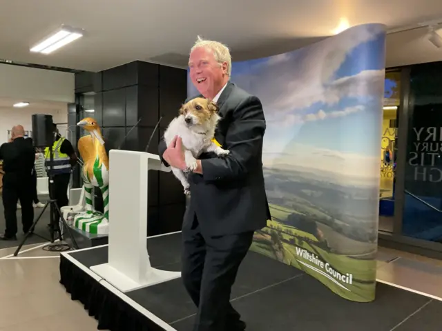 Brian Matthew on podium with dog Heidi