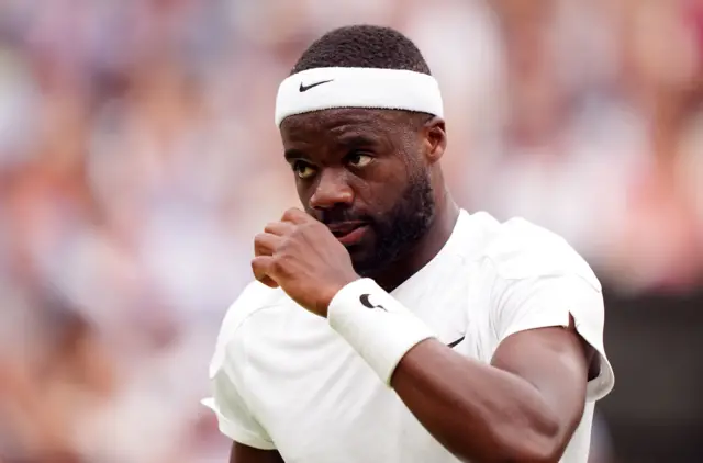 Frances Tiafoe nods in celebration