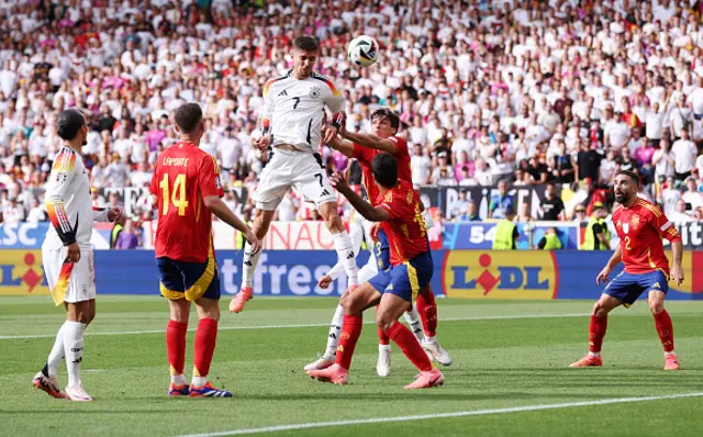 : Kai Havertz of Germany has a a headed shot whilst under pressure from Robin Le Normand