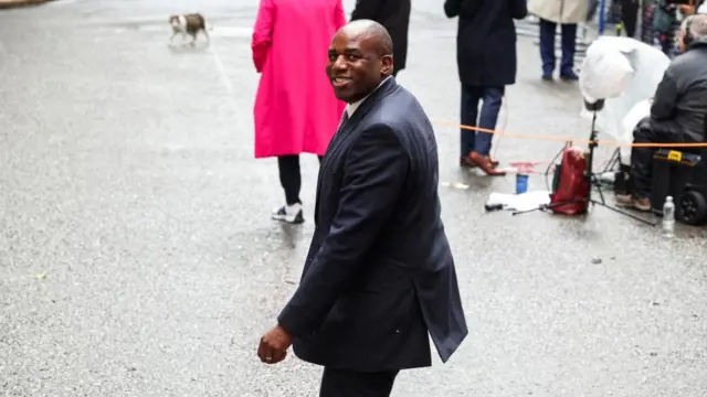 Britain's Foreign Secretary David Lammy walks outside Downing Street on the day of the first cabinet meeting with British Prime Minister Keir Starme