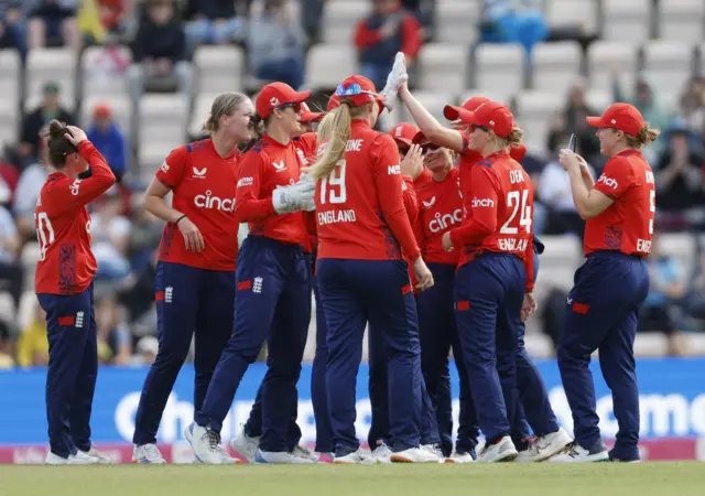 England celebrate the run out of Georgia Plimmer