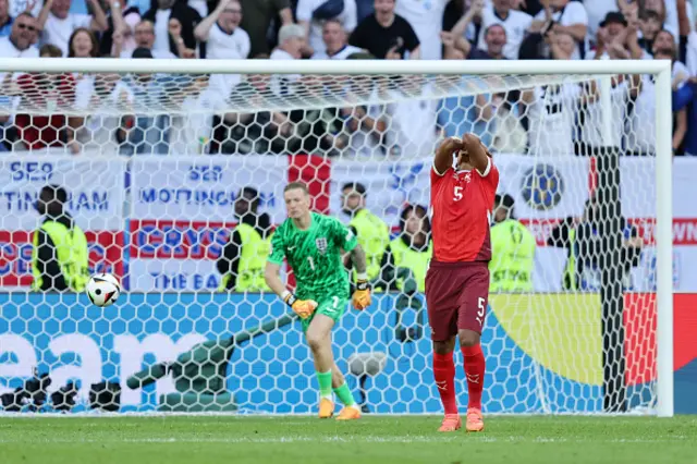 Manuel Akanji of Switzerland reacts