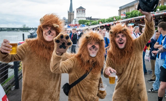 Three Lions in fancy dress