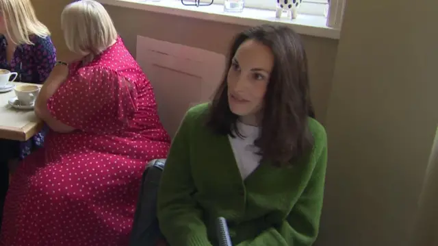 A woman in a Bury cafe