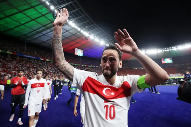 Hakan Calhanoglu of Turkiye acknowledges the fans after