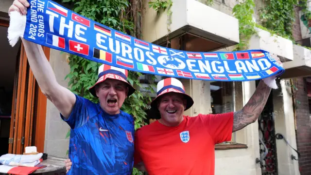 England fans holding a scarf aloft in Dusseldorf