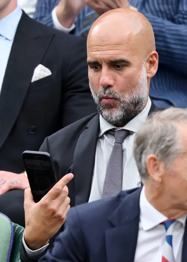 Pep Guardiola takes a photo of himself