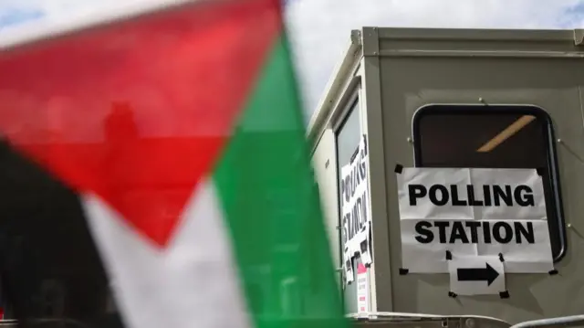 Palestinian flag outside a polling station