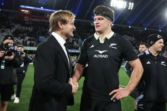 Scott Robertson and Scott Barrett shaking hands