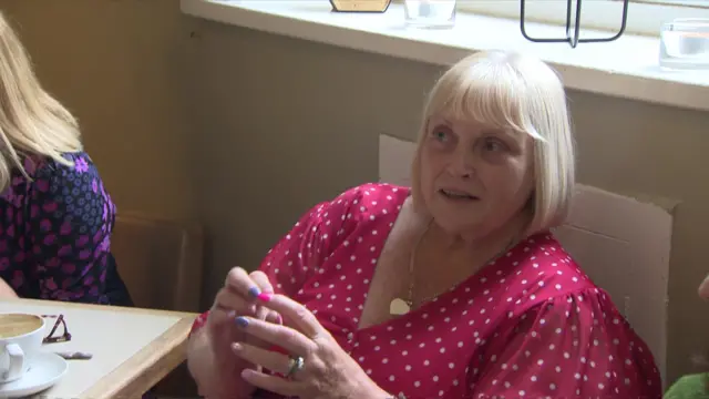 A woman in a Bury cafe