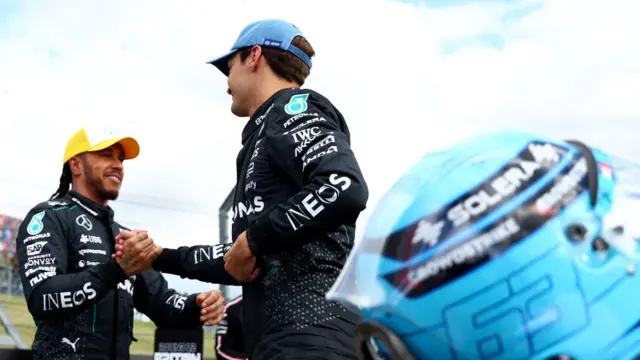 Lewis Hamilton and George Russell shake hands