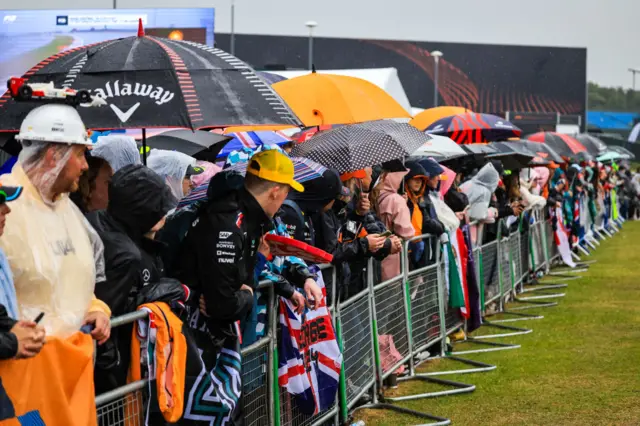 Fans under umbrellas at Silverstone