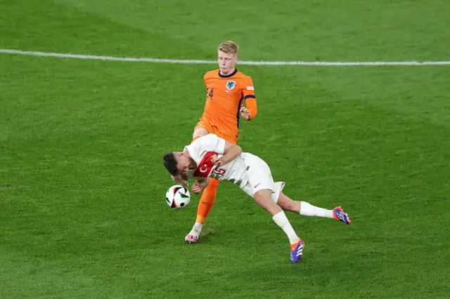 Tijjani Reijnders of the Netherlands challenges Salih Ozcan