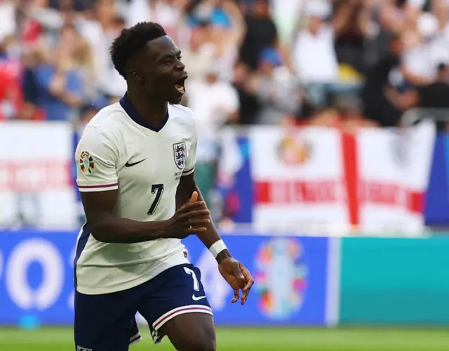 Bukayo Saka celebrates