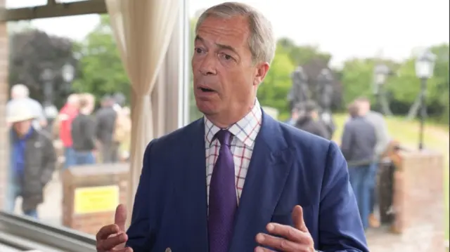 Reform UK leader Nigel Farage speaks to the media during a visit to Wyldecrest Sports Country Club in Corringham