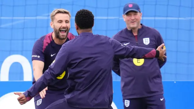 Luke Shaw smiles during England training at Euro 2024