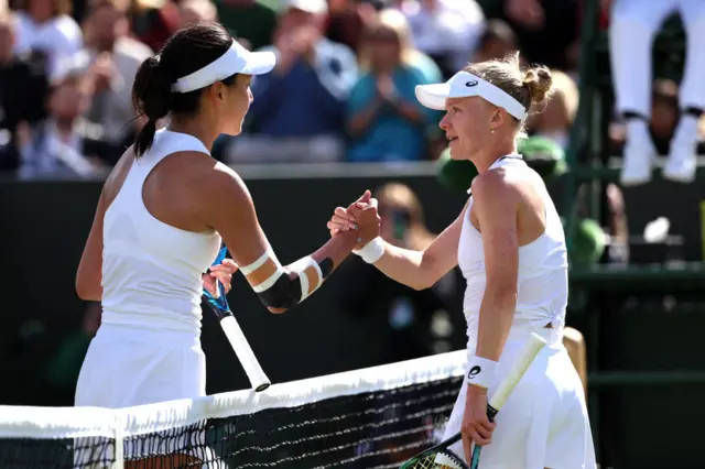 Wang and Dart shake hands at the net