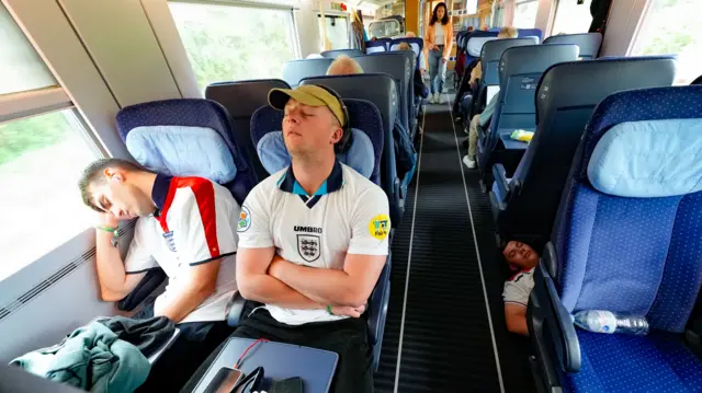 England fans asleep on train to Dusseldorf for the Euro 2024 game against Switzerland