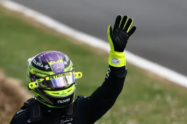 Lewis Hamilton waves to the crowds