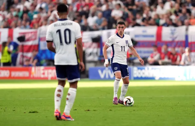 Phil Foden looks to make a pass towards Jude Bellingham while playing for England at Euro 2024