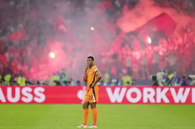 Denzel Dumfries of Netherlands looks dejected