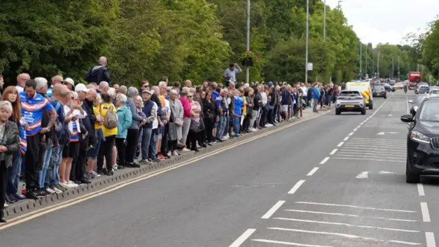 Crowds line the funeral route