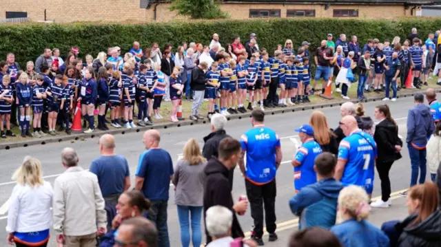 Crowds line the funeral route