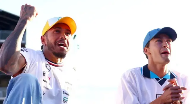 Lewis Hamilton and George Russell watch England on the big screens at Silverstone