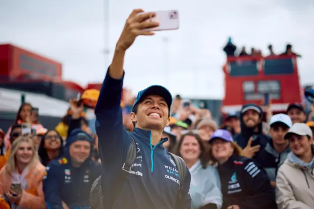 alex albon takes pictures with fans