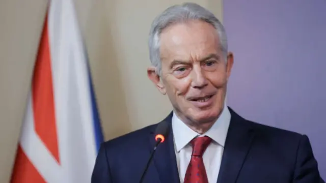 Tony Blair gestures as he speaks during a press conference with Kosovo President following their meeting in Pristina on June 10, 2024.