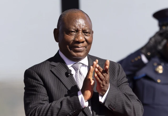 South Africa's President Cyril Ramaphosa clapping