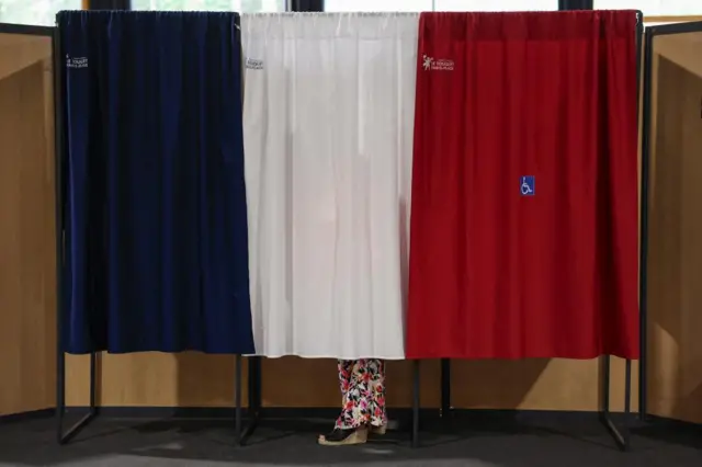 A voter at a polling station during the second round of French parliamentary elections in Le Touquet-Paris-Plage, northern France, 07 July 2024.
