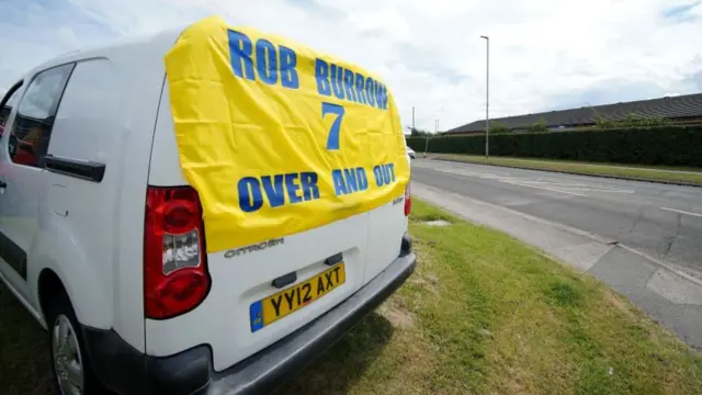 A banner in tribute to Rob Burrow