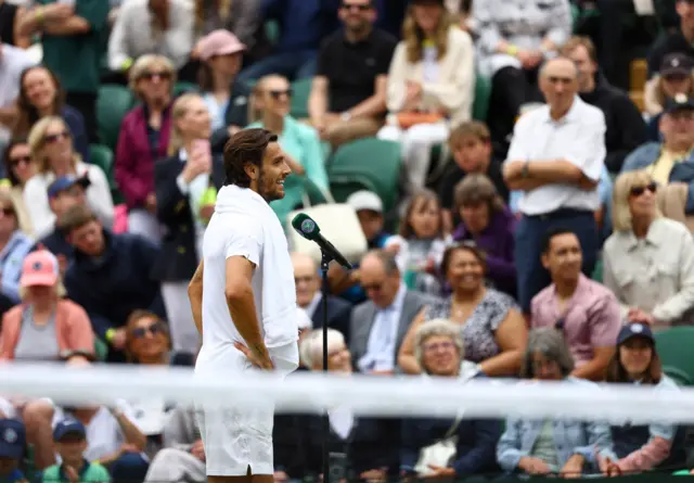 Lorenzo Musetti speaking during the on court interview