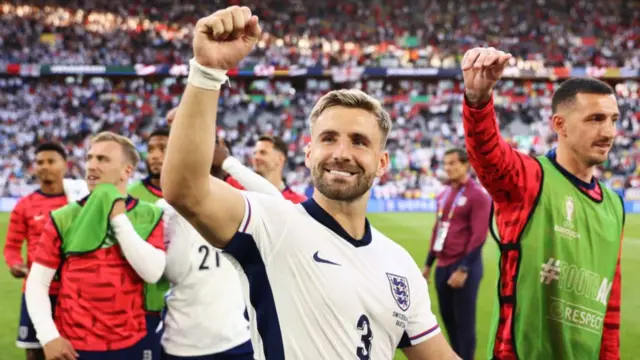 Luke Shaw of England celebrates following the team's victory in the penalty shoot out during the UEFA EURO 2024 quarter-final match between England and Switzerland at Düsseldorf Arena on July 06, 2024 in Dusseldorf, Germany.