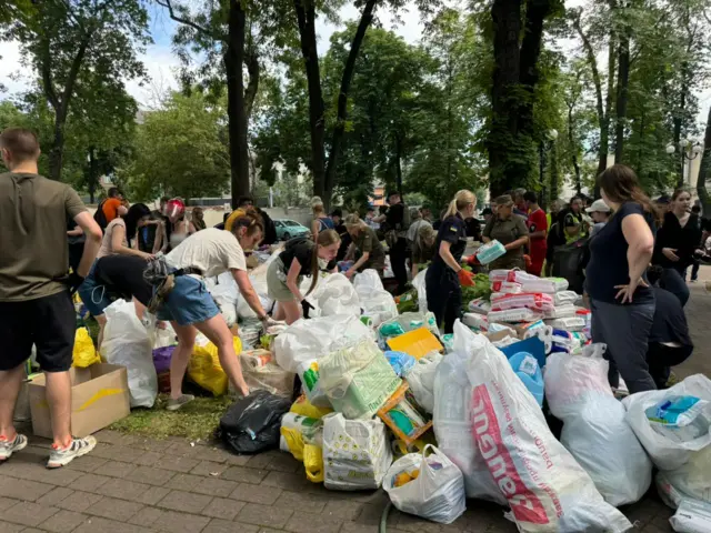 Volunteers gather bags of donated goods for the hospital in the capital.