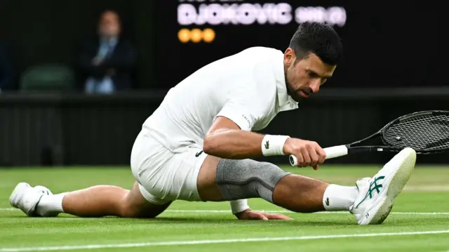 Novak Djokovic stretches to reach the ball