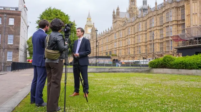 New Green MP Adrian Ramsay was interviewed outside Westminster on College Green