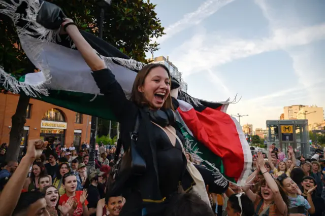 A woman celebrates in Toulouse