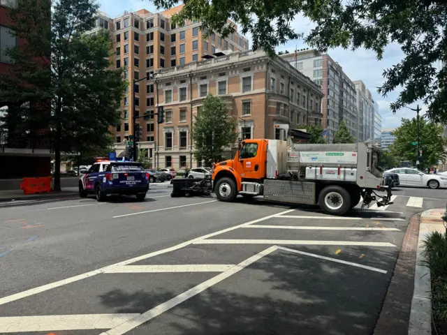 Police car and dump truck near the White House