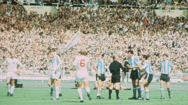 Antonio Rattin and his Argentina team-mates complain to the referee after he was sent off in the 1966 World Cup quarter-finals against England