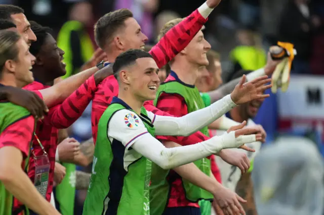 Phil Foden celebrates with England players