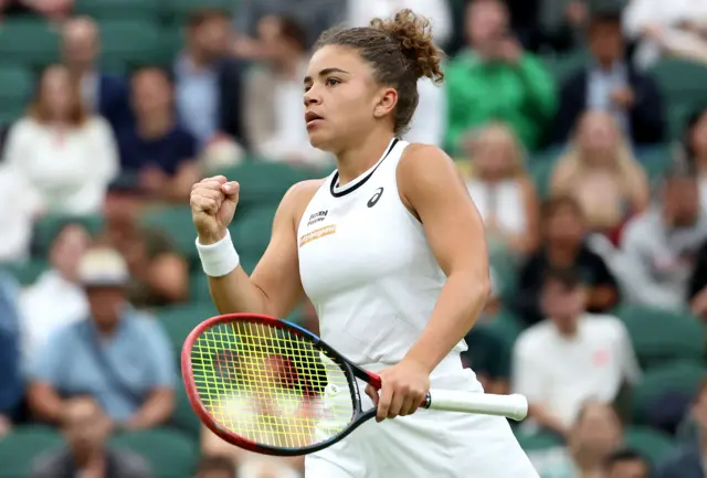 Jasmine Paolini clenches her fist in celebration