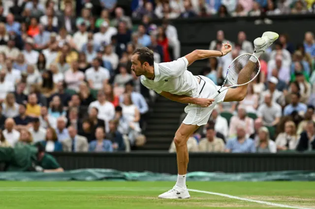 Daniil Medvedev serves