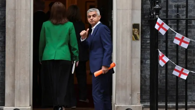 Mayor of London Sadiq Khan gestures outside Downing Street in London,